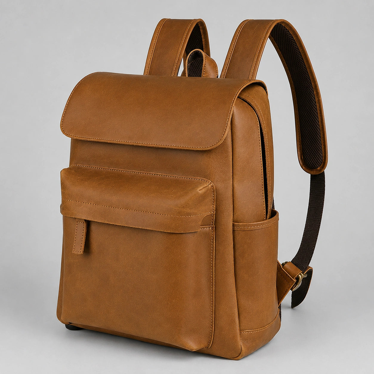 Side profile showing leather strap and pockets