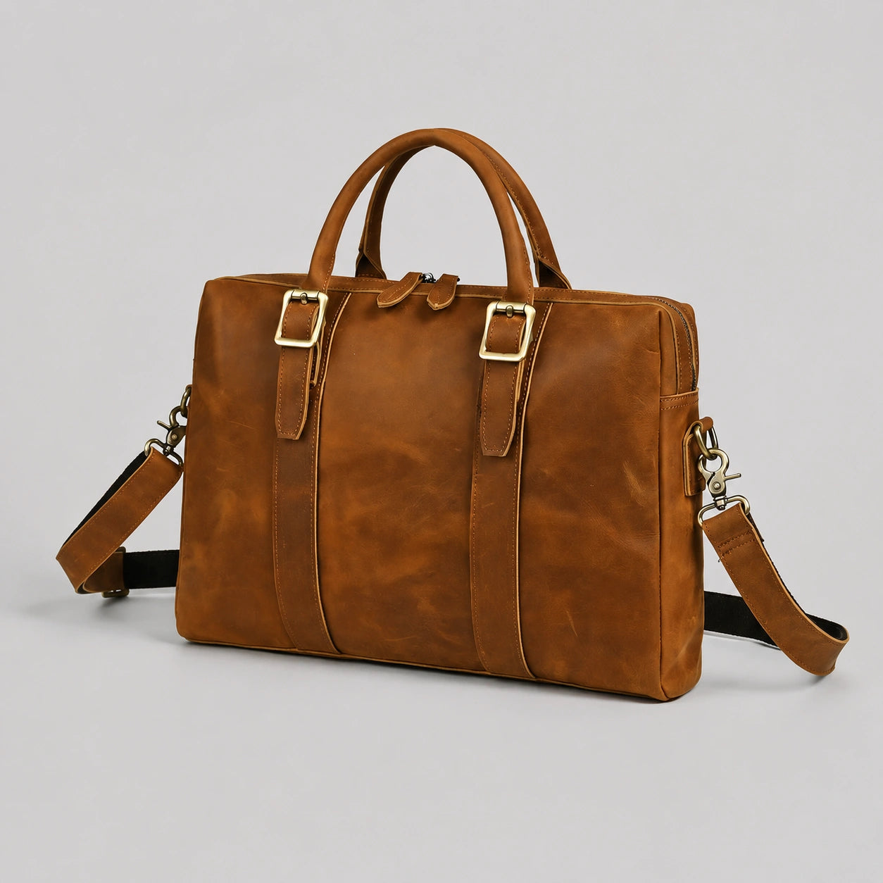 Side view of premium brown crazy horse leather briefcase with external zipper pocket and leather texture