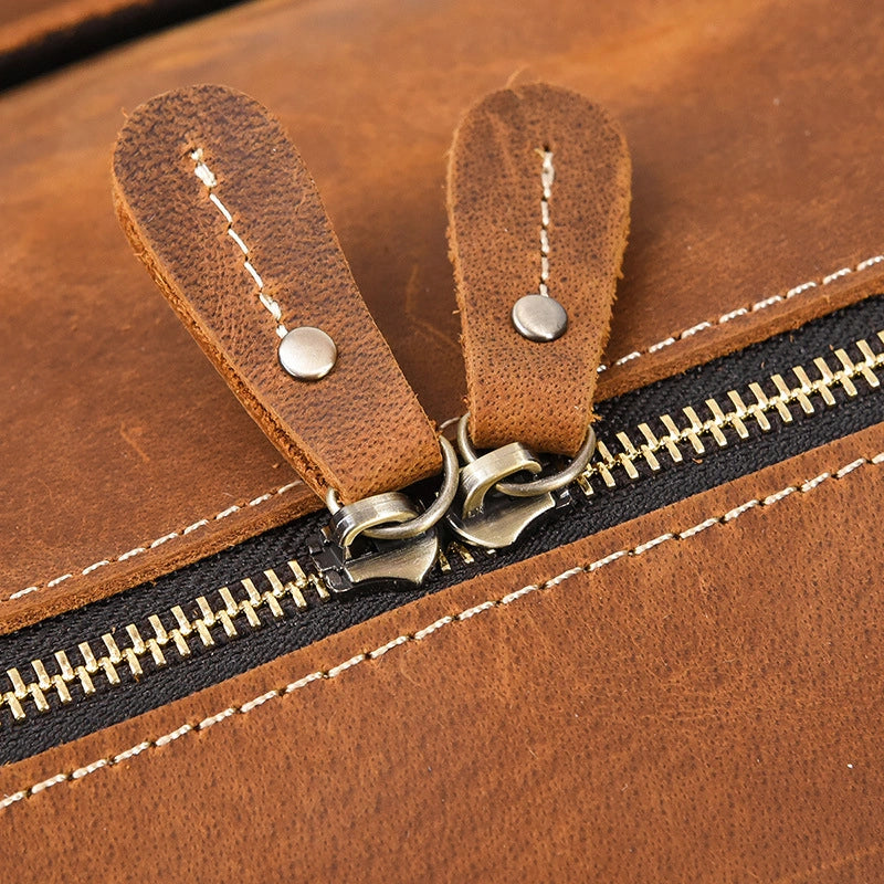 Premium brass zipper detail on leather travel duffel
