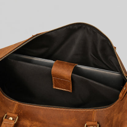 Spacious interior compartment of leather weekender bag