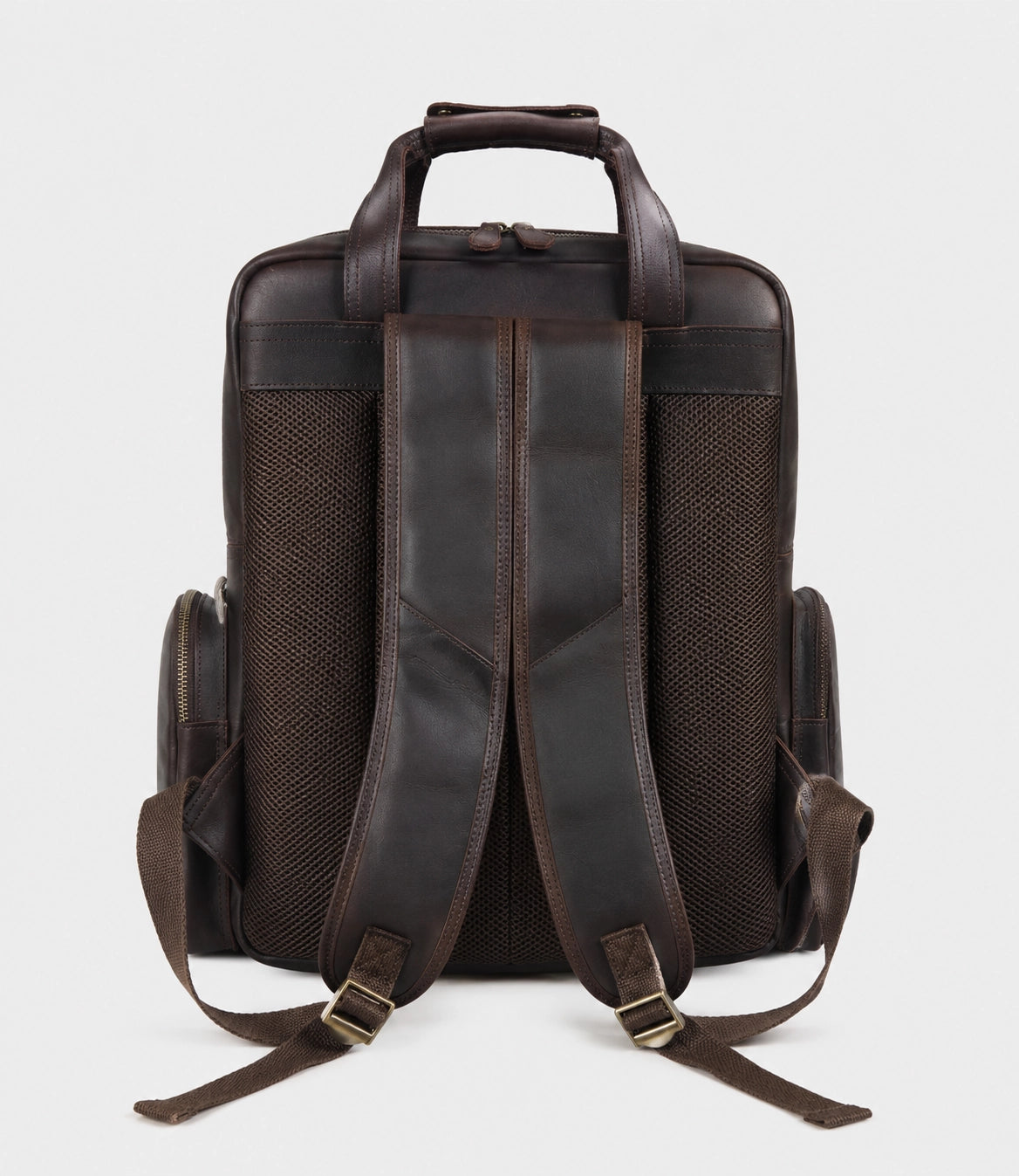 Dark brown leather camera backpack rear view with adjustable padded shoulder straps and mesh back panel, high-quality brass hardware, straps for tripod attachment, professional DSLR storage.