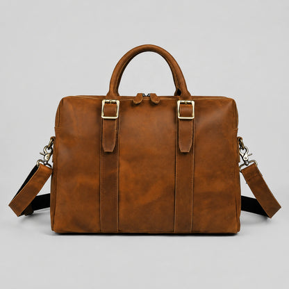 Vintage brown crazy horse leather briefcase front view with handles and adjustable strap