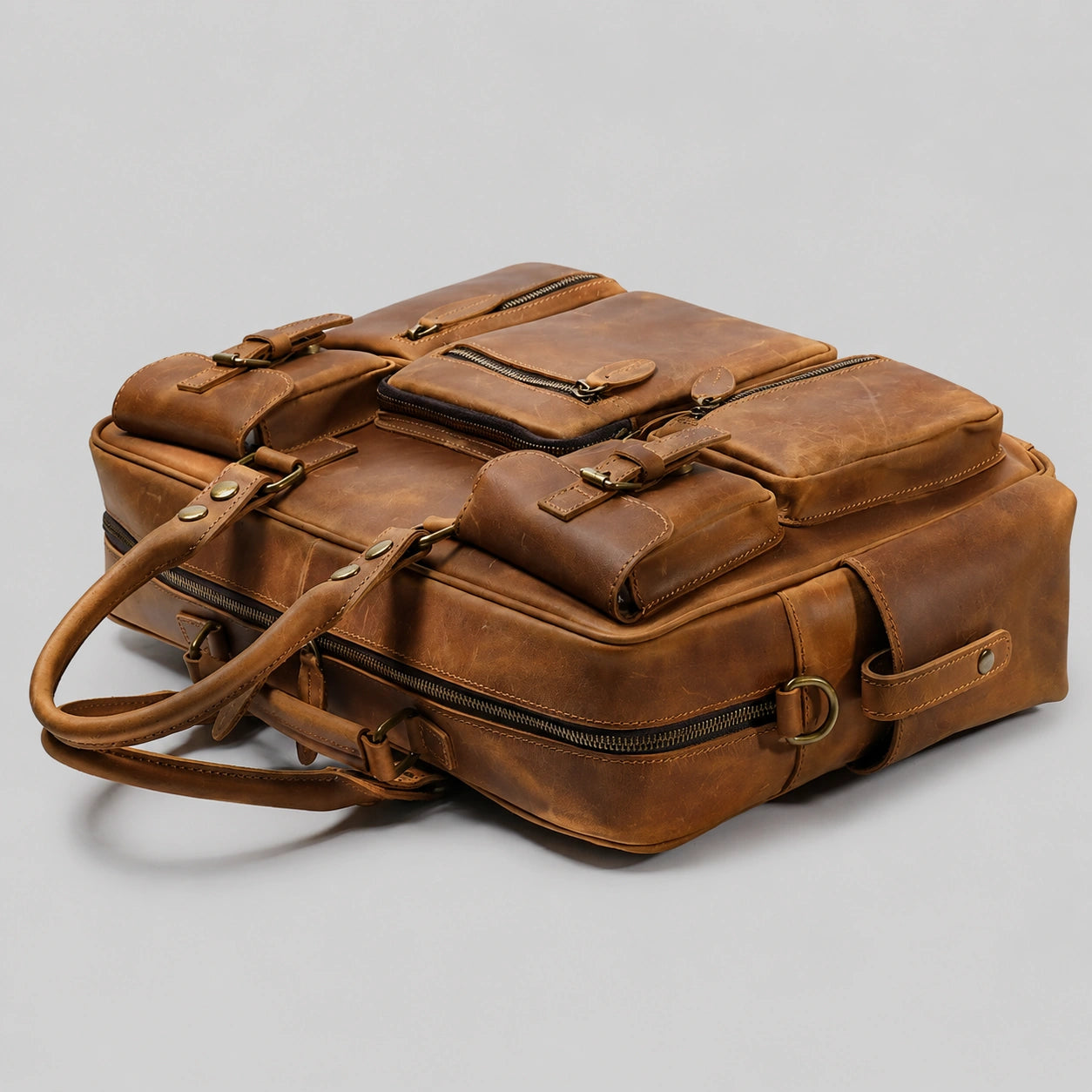 Overhead perspective of leather briefcase, showing overall structure and compartments