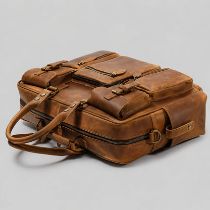 Overhead perspective of leather briefcase, showing overall structure and compartments